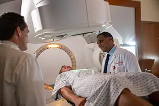 Presbyterian radiation oncologists using targeted radiation therapy to help treat a patient’s cancer.